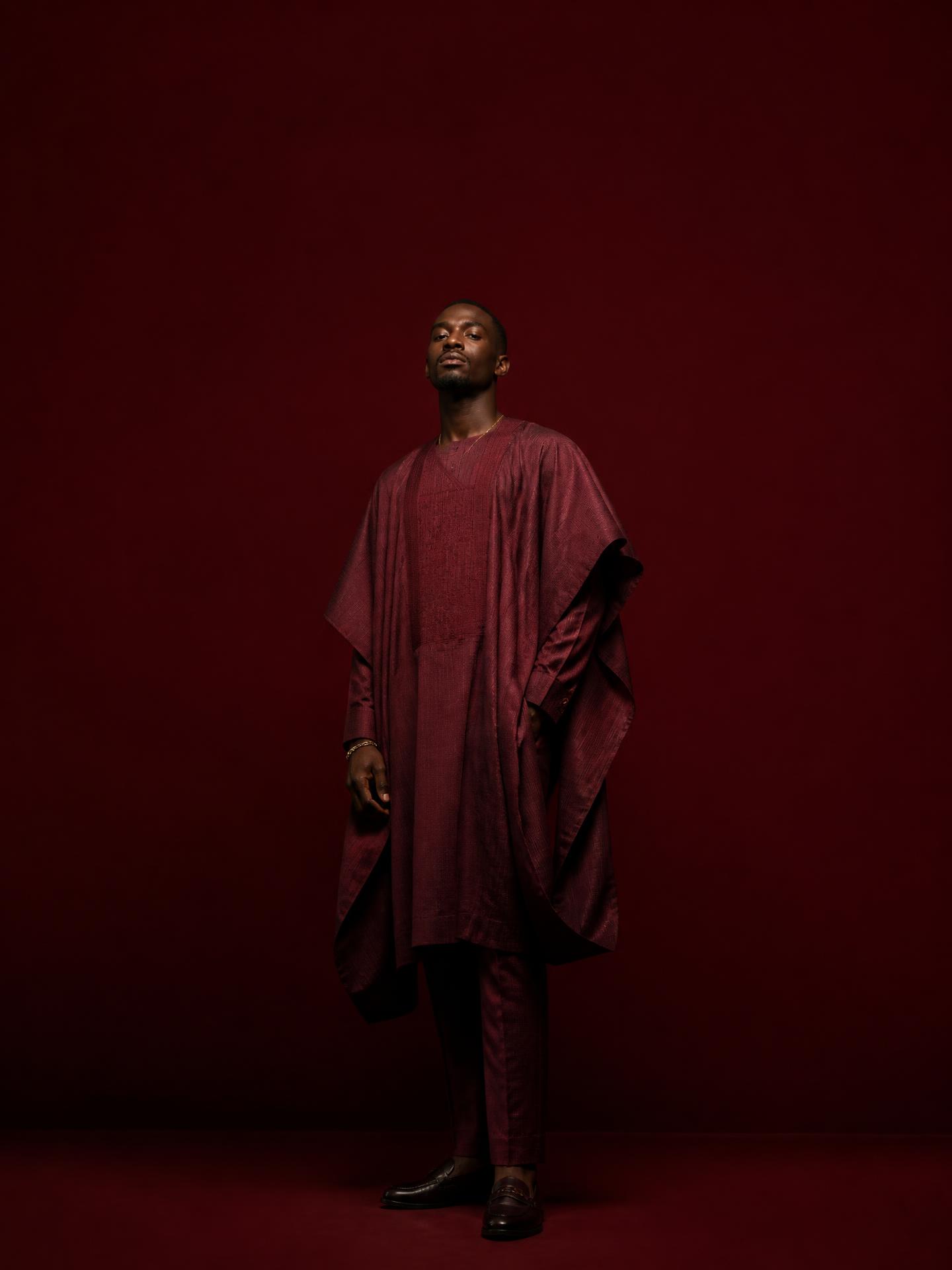 Timileju editorial — contemporary agbada-inspired tailoring on oxblood